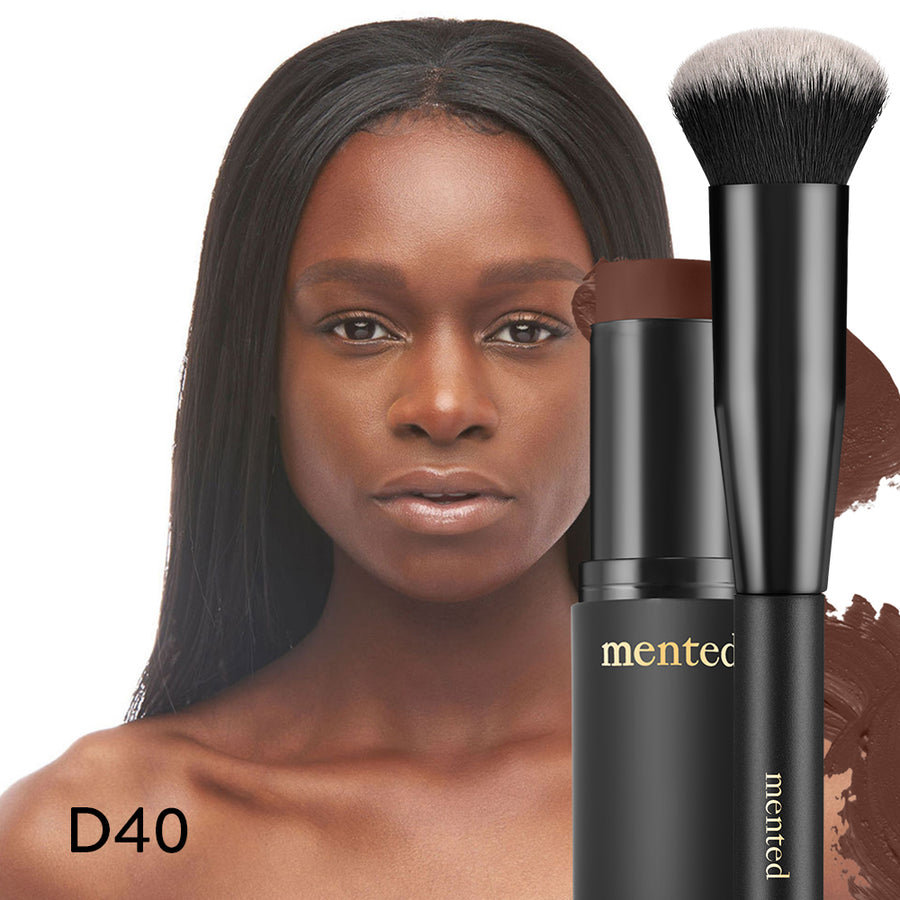 woman model with D40 colored Foundation Stick and brush